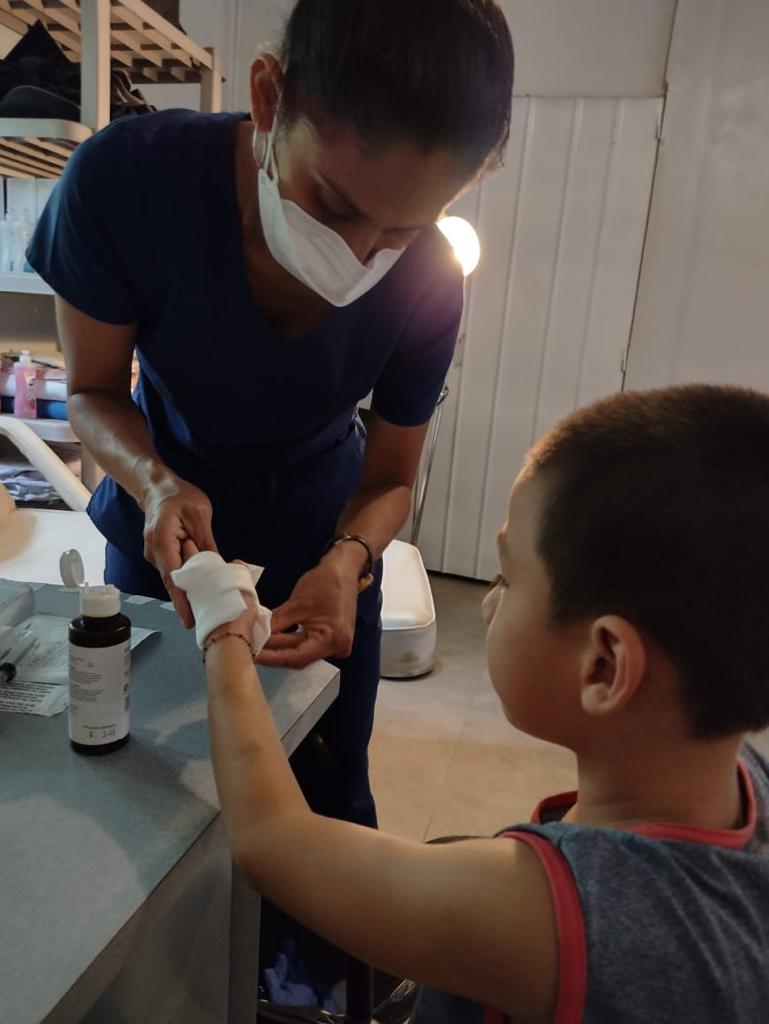 loving-with-mercy-clinic-program-child-bandaged-arm-care