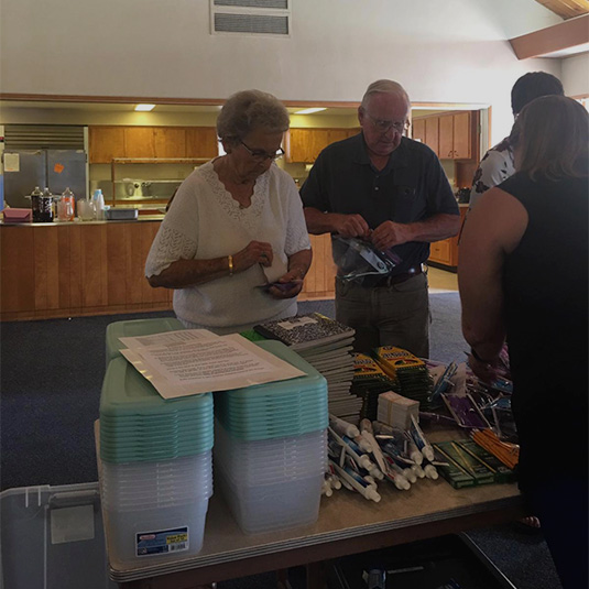 loving-with-mercy-us-volunteers-packing-christmas-boxes
