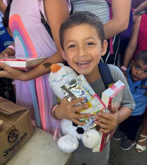 loving-with-mercy-el-salvador-community-happy-kid-with-supplies