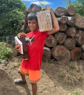 loving-with-mercy-el-salvador-community-outreach-kid-with-box-of-gifts