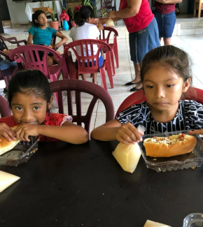 loving-with-mercy-el-salvador-feeding-program-kids-eating-sandwich