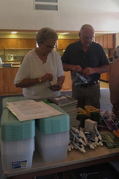 loving-with-mercy-us-volunteers-packing-christmas-boxes